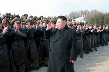 North Korean leader Kim Jong Un visits Korean People's Army pilots who have completed a tour of battle sites in the area of Mt Paektu, in this undated photo released by North Korea's Korean Central News Agency (KCNA) on April 19, 2015. REUTERS/KCNA