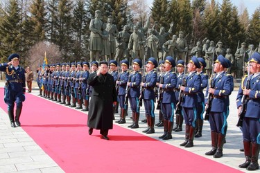 North Korean leader Kim Jong Un inspects an honour guard as he visits the Korean People's Army pilots who have completed a tour of battle sites in the area of Mt Paektu, in this undated photo released by North Korea's Korean Central News Agency (KCNA) on April 19, 2015. REUTERS/KCNA