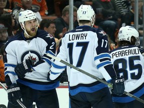 Adam Pardy #2 of the Winnipeg Jets celebrates with Adam Lowry #17 after scoring a goal on the second period against the Anaheim Ducks in Game Two of the Western Conference Quarterfinals during the 2015 NHL Stanley Cup Playoffs at Honda Center on April 18, 2015 in Anaheim, California.