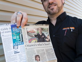 Stephane Clement poses for a photo holding Ottawa Sun newspaper clippings and Stanley Cup playoff tickets featuring him from 18 years ago on Friday April 17, 2015. 
Errol McGihon/Ottawa Sun/Postmedia Network