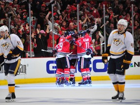 The Chicago Blackhawks celebrate a goal during the second period in game three of the first round of the 2015 Stanley Cup Playoffs at the United Center. (David Banks-USA TODAY Sports)
