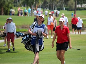 Bath golfer Augusta James and her caddy, Napanee’s Ryan Desveaux, walk the course during the Chico Berg Memorial in Fort Myers, Fla. on Sunday. (COURTESY of SYMETRA TOUR)