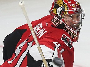 Ottawa Senators Craig Anderson tries to find the puck during second period action against the Montreal Canadiens at the Canadian Tire Centre in Ottawa Sunday April 19, 2015. Tony Caldwell/Postmedia Network