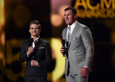 Singer Hunter Hayes (L) and professional football player Jason Witten speak onstage during the 50th Academy Of Country Music Awards at AT&T Stadium on April 19, 2015 in Arlington, Texas.   Ethan Miller/Getty Images for dcp/AFP