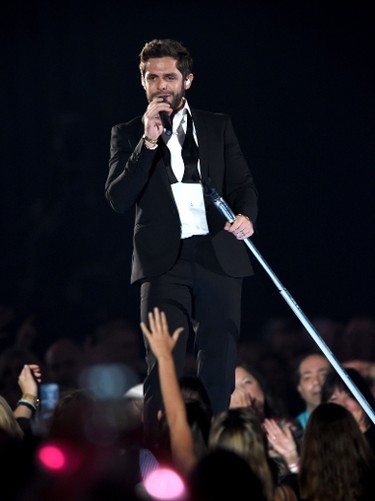 Recording artist Thomas Rhett performs onstage during the 50th Academy Of Country Music Awards at AT&T Stadium on April 19, 2015 in Arlington, Texas.   Cooper Neill/Getty Images for dcp/AFP