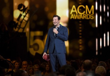 Professional football player Tony Romo speaks onstage during the 50th Academy Of Country Music Awards at AT&T Stadium on April 19, 2015 in Arlington, Texas.   Ethan Miller/Getty Images for dcp/AFP