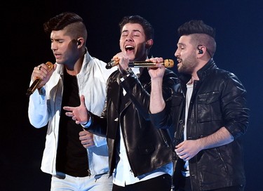 (L-R) Musician Dan Smyers, Shay Mooney of Dan + Shay and singer/actor Nick Jonas (center) perform onstage during the 50th Academy Of Country Music Awards at AT&T Stadium on April 19, 2015 in Arlington, Texas.   Ethan Miller/Getty Images for dcp/AFP