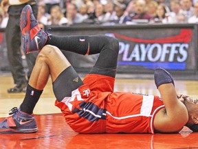Paul Pierce lies on the ACC floor after momentarily hurting his shoulder. (AFP)