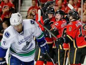 The Calgary Flames celebrate Sam Bennett's third-period goal in Sunday's 4-2 win over the Vancouver Canucks in Game 3. The Flames lead the series 2-1. 
CALGARY SUN