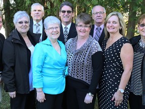 The Dresden Minor Hockey Moms inducted into the Dresden Sports Hall of Fame in the builder category Saturday include, front row, left: Maryellen Konecny, Kathleen Ritchie, Leone Diebel, Cheryl Cameron, Carla Fox and Lorraine Dreveny. Dennis Lindsay, back row, left, was inducted as a legend, while Ken Higgs, centre, and Rick Chinnick represent the 1968-69 and 1969-70 Dresden midget hockey teams. Absent is male-athlete inductee Jim Ritchie. (MARK MALONE/Postmedia Network)