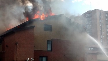 Fire crews battled a four-alarm fire Saturday at a Deerfield Dr. housing complex. About 75 people have been left homeless. (ORLANDO BLACKSMITH Submitted images Ottawa Sun / Postmedia Network)