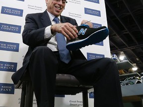 Federal Finance Minister Joe Oliver gets a new pair of shoes ahead of budget day Monday April 20, 2015. (Michael Peake/Toronto Sun)