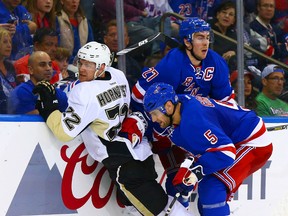Pittsburgh Penguins right wing Patric Hornqvist (72) is checked into the boards by New York Rangers defenseman Dan Girardi (5) in game 2 of the 2015 NHL Stanley Cup Playoffs Round 1 at Madison Square Garden April 18, 2015. (Andy Marlin-USA TODAY Sports)