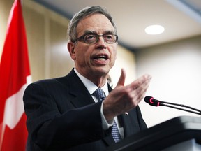 Canada's Finance Minister Joe Oliver talks to the media after meeting with private sector economists in Ottawa, April 9, 2015. (PATRICK DOYLE/Reuters)