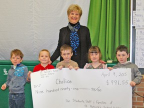 Students at St. Patrick's School in Dublin did a little extra during Lent this year, and raised close to $1,000 ($991.55) for an international Catholic charity called Chalice. Local Chalice member Betty Duwyn, from Mitchell, was on hand to receive a cheque from Marcus Bosazzi (left), Henry Schalk, Tyler Ryan, Allison Bleck and Tyler Scherbarth. KRISTINE JEAN/MITCHELL ADVOCATE