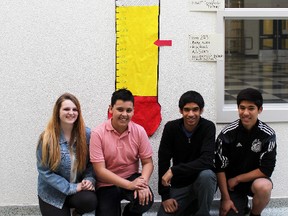 Grade 8 students from Louise Arbour French Immersion proudly show the progress they’ve made with fundraising through their goal meter on April 14, 2015. From left to right; Aaliyah Stewart, Ayaz Ghasenpour, Akran Hannoufa and Jed Shams. MIRANDA BRUMWELL\SPECIAL TO THE LONDONER\POSTMEDIA NETWORK