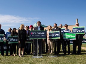 Wildrose Party leader Brian Jean (centre) speaks during a press conference near the Grey Nuns Hospital in Edmonton, Alta., on Monday April 20, 2015. Jean announced the party's Wildrose Wait Time Guarantee at the event. Ian Kucerak/Edmonton Sun/Postmedia Network