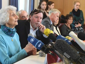 Eva Pusztai-Fahidi (L), survivor of the Auschwitz concentration camp and Christoph Heubner, executive Vice-President of the International Auschwitz Comitee (2nd L) attend a news conference in Lueneburg, April 20, 2015. The trial against Oskar Groening, 93, a former Nazi officer from Auschwitz concentration camp, accused of being an accomplice to 300,000 murders, will start on April 21 in Lueneburg. REUTERS/Fabian Bimmer