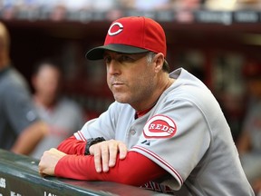 Manager Bryan Price of the Cincinnati Reds watches from the dugout during the MLB game against the Arizona Diamondbacks at Chase Field on May 29, 2014 in Phoenix, Arizona. (Christian Petersen/Getty Images/AFP)