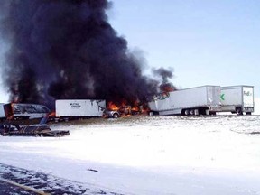 A fiery chain-reaction crash involving 59 semis and cars on a snowy Wyoming highway left one person dead on Monday, April 20, 2015. (Postmedia Network/Wyoming Highway Patrol)