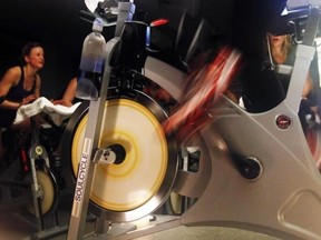 The wheels of an indoor bicycle are seen spinning at a SoulCycle class at their Union Square location in New York April 13, 2011. (Reuters/Shannon Stapleton)