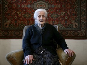 Silvard Atajyan, 103, sits at home during an interview with Reuters in Yerevan, April 20, 2015. (REUTERS/David Mdzinarishvili)