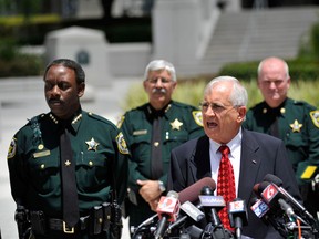 Lawson Lamar, the State Attorney in the Ninth Judicial Circuit of Florida speaks in front of the Ninth Judicial Court in Orlando, Florida May 2, 2012. Lamar announced that 13 people are being charged with felony hazing and 20 with misdemeanour hazing in connection with the hazing death of Florida A&M University band major Robert Champion. REUTERS/Octavian Cantilli