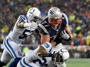 New England Patriots tackle Nate Solder gets past Indianapolis Colts linebacker D’Qwell Jackson (52) and strong safety Mike Adams (29) after catching a pass to score a touchdown in the AFC Championship Game at Gillette Stadium. (Robert Deutsch-/USA TODAY Sports)