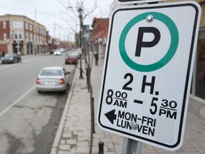Cars park in front of the retail stores along Wellington Street West on Apr. 9, 2015. Ottawa council is engaging in public consultation to review the free on-street parking policy for sections of Wellington St. West and Richmond Rd. (Andrew Meade/ Ottawa Sun/ Postmedia Network)