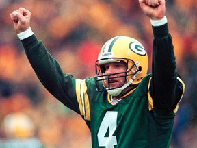 Green Bay Packers quarterback Brett Favre reacts after completing a touchdown pass during the NFC divisional playoff game in Green Bay in this January 4, 1998 file photo. (REUTERS/Stringer/Files)