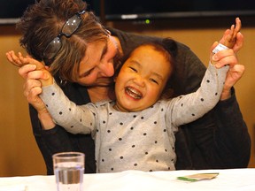 Johanne Wagner with daughter Phuoc, 3, who in February received a liver transplant from her adoptive father Michael as did her twin sister Binh from an anonymous donor at Sick Kids Hospital on Tuesday April 21, 2015. Michael Peake/Toronto Sun/Postmedia Network