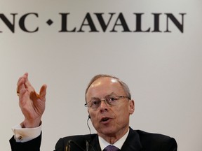 Robert G. Card, president and chief executive officer of SNC-Lavalin gestures during a news conference following their annual general meeting in Montreal, May 8, 2014.  REUTERS/Christinne Muschi