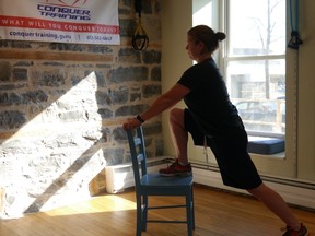 An elevated lunge stretch on a chair is a good exercise to help decrease arthritic pain. (Supplied photo)