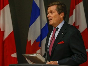 Toronto Mayor John Tory comments on the federal budget at City Hall in Toronto on Tuesday, April 21, 2015. (Dave Thomas/Toronto Sun)