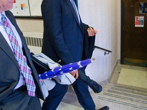 Western University president Amit Chakma walks into a meeting with the faculty of Arts and Humanities after a debate as to whether the meeting be open or closed to the media. Chakma would not attend if the media was present. (MIKE HENSEN, The London Free Press)