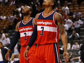 John Wall (left) and Bradley Beal of the Washington Wizards watch the seconds tick down on the clock in the second half at the Air Canada Centre on Tuesday night. (Jack Boland/Toronto Sun)