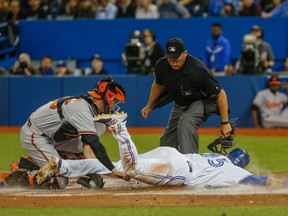 Dalton Pompey of the Blue Jays slides home safely in his team's win over the Baltimore Orioles on April 21, 2015. (DAVE THOMAS/Toronto Sun)