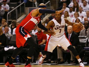 Washington Wizards' Drew Gooden (left) guards the Raptors' Kyle Lowry at the ACC on Tuesday night. (Jack Boland/Toronto Sun)