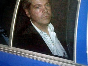John Hinckley Jr. arrives at the E. Barrett Prettyman U.S. District 
Court in Washington, in this November 19, 2003 file photo. A U.S. federal judge began hearings April 22, 2015 on whether would-be presidential assassin Hinckley Jr. could get more time outside the mental hospital where he has lived since shooting Ronald Reagan in 1981. REUTERS/Brendan Smialowski