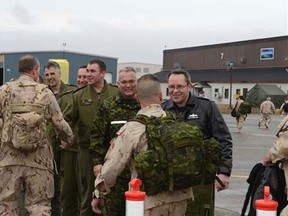 Wing Commander Colonel Iain S. Huddleston (right) and Wing Chief Warrant Officer Pierrot Jette (second from right) along with much of the Command Team, welcome home members of 14 Wing Greenwood returning from Operation IMPACT in the Middle East.
(Corporal Don Kirkwood/HANDOUT)