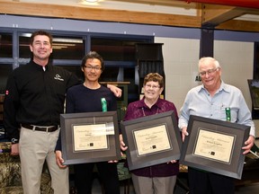 Ducks Unlimited Canada's Robert Watson poses with Cochrane committee members Ena Farquhar, Willard Farguhar, and James Lim after presenting them with certificates thanking them for 15 years of volunteering with Ducks Unlimited. Watson made the presentation  during Saturday night's  28th Annual Cochrane Committee's Ducks Unlimited Canada fundraiser dinner and auction held at the Tim Horton's Event Centre.