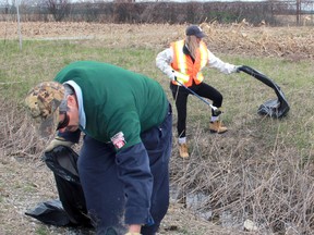 Ron Jeffrey and Brenda Hanlon, employees of Pembina Pipeline Corp., volunteered to pick up trash along Petrolia Line as part of Wednesday's Earth Day observance. A group of about 25 employees from the company's Corunna location volunteered to pick up trash on highways and roads surrounding the facility. Photograph taken near Sarnia, Ontario on Wednesday, April 22, 2015. (Terry Bridge/Sarnia Observer/Postmedia Network)