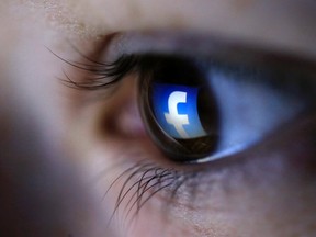 A picture illustration shows a Facebook logo reflected in a person's eye, in Zenica, March 13, 2015. (REUTERS/Dado Ruvic)
