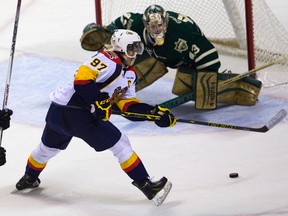 Connor McDavid of the Otters steals the puck and breaks in on Knights goalie Michael Giugovaz who made the save late in the second period at Budweiser Gardens in London, Ont. on Tuesday April 14, 2015. Mike Hensen/Postmedia Network