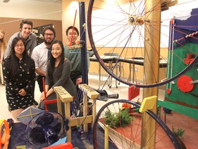 Building a Rube Goldberg-machine for a university class were, front row from left, Amanda Thoo and Melody Zhao; back row, Ben Shalansky, Ryan Healey and Henry Li. (Michael Lea/The Whig-Standard)