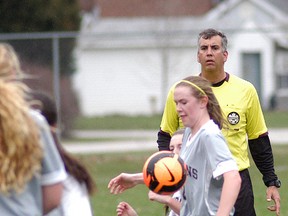 Wallaceburg Tartans girls soccer player Shae Denys controls the ball against an Ursuline Lancers player during the Tartans' season opener held on April 16 at Steinhoff Park. The Lancers won the game 2-0.