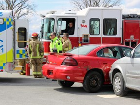 Kingston Police, Kingston Fire and Rescue, and Frontenac Paramedic Services collaborate to create a texting and driving PSA commercial in Kingston on Wednesday. (Steph Crosier/The Whig-Standard)