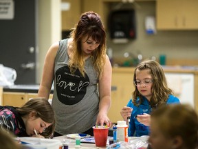 Artist Justine Vandenhouten works with Madison Martell during the monthly Be-You-tiful day at the BGCC Teen Centre on April 18, 2015 in Whitecourt, Alta. She will be facilitating a session at the Go Girl Conference in Whitecourt on May 2.

Christopher King | Whitecourt Star | Postmedia Network