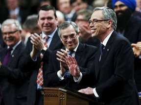 Canada's Finance Minister Joe Oliver receives a standing ovation while delivering the federal budget in the House of Commons on Parliament Hill in Ottawa, April 21, 2015. (CHRIS WATTIE/Reuters)