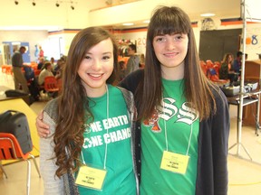 Isabelle Burns, left, and Alyssa Burrows are two of the organizers of Wednesday's One Earth One Chance environmental summit at Bayridge Secondary School. About 150 elementary and secondary school students gathered to discuss environmental topics. (Michael Lea/The Whig-Standard)